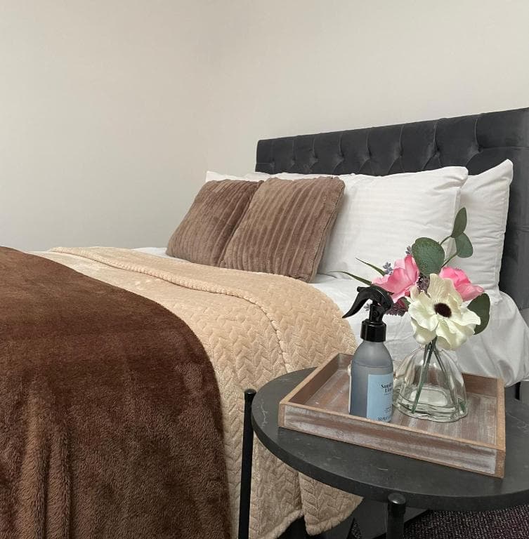 Double bed dressed with fresh linens at Edenderry Central Rooms