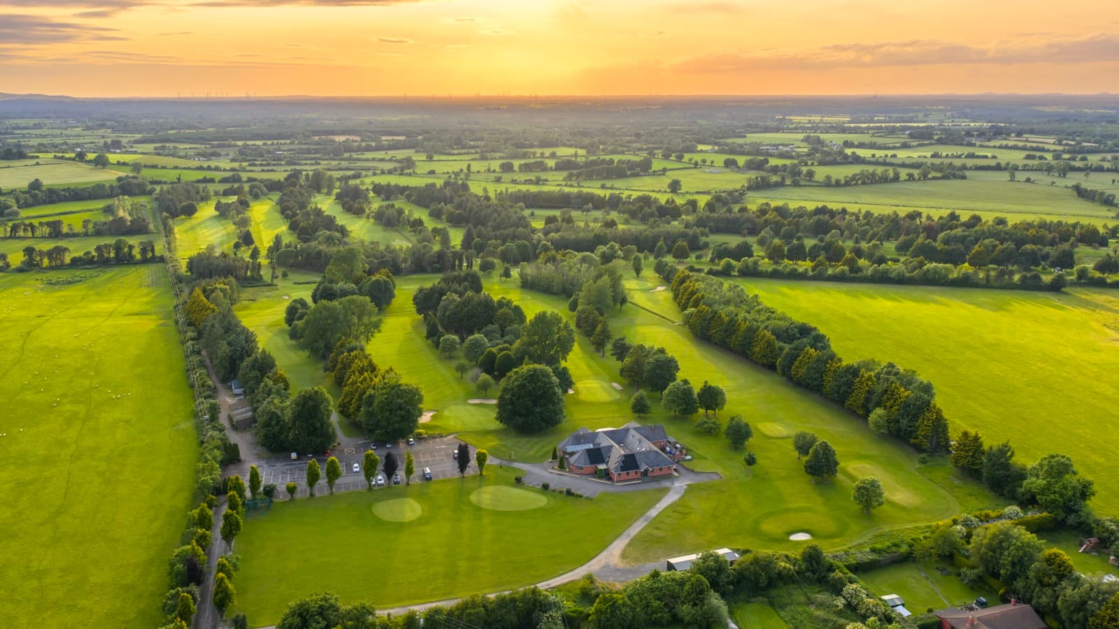Edenderry Golf Club fairways and clubhouse at sunset