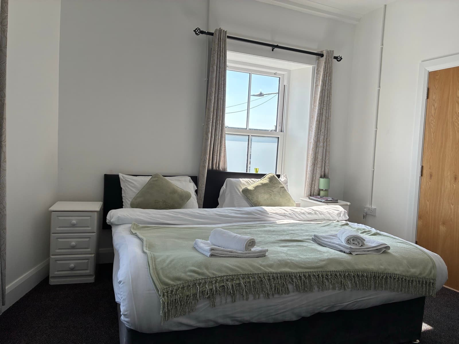 Family room with a double bed and a single bed at Edenderry Central Rooms